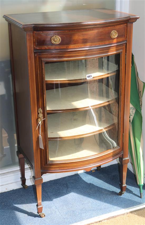 An Edwardian inlaid mahogany bow fronted music cabinet W.58cm